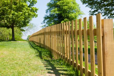 Woody fence in park clipart
