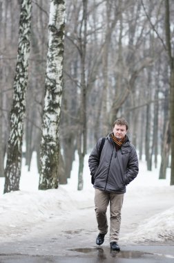 Lonely sad man in winter clipart