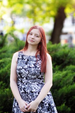 Young beautiful girl in summer