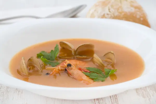 Soup with seafood in white plate — Stock Photo, Image