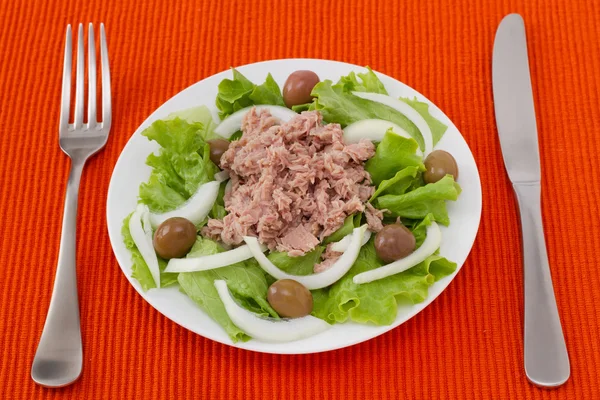 Tuna salad with olives in white plate — Stock Photo, Image
