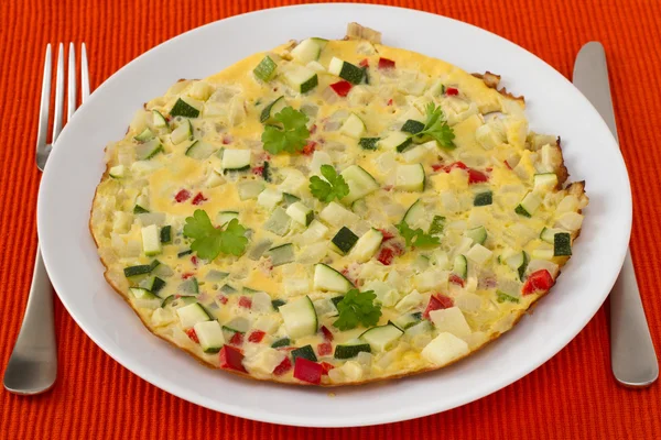 Omelet with vegetables on the plate — Stock Photo, Image