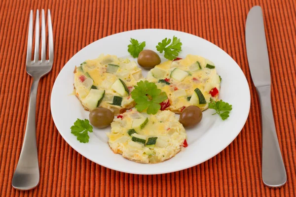 Omelet with vegetables on the plate — Stock Photo, Image
