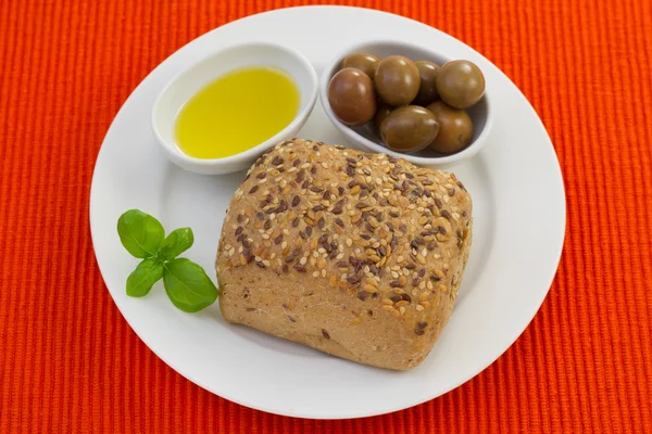 Bread with olives and olive oil — Stock Photo, Image