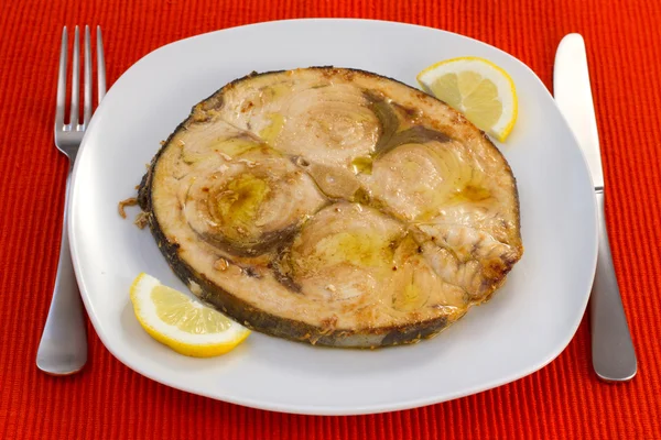 Fried swordfish with lemon on the white plate — Stock Photo, Image