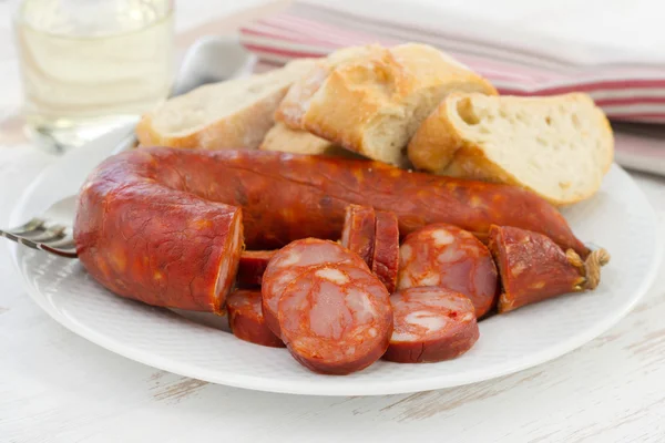 Sausages with bread on the white plate — Stock Photo, Image