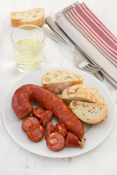 Sausages with bread on the white plate — Stock Photo, Image