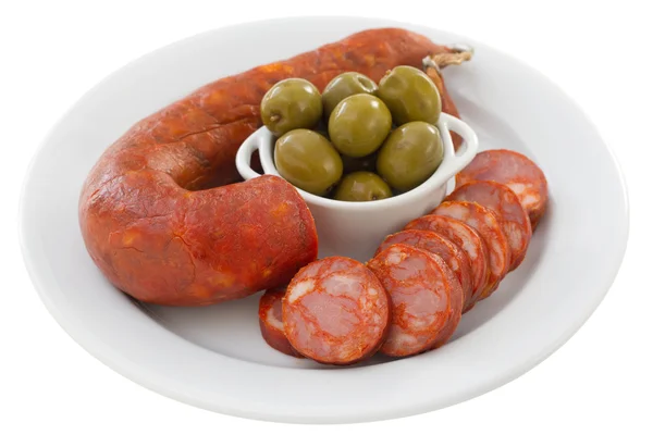 Sausages with olives on the white plate — Stock Photo, Image