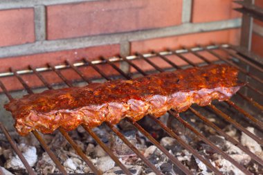 Pork ribs on a grill clipart