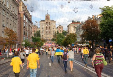 Ukrainian, Swedish and English fans go to the fanzone before mat clipart