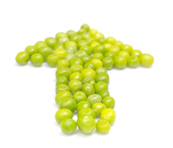 Groene erwt peulen in de vorm van een pijl — Stockfoto