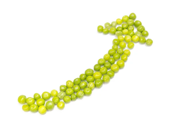 Groene erwt peulen in de vorm van een pijl — Stockfoto