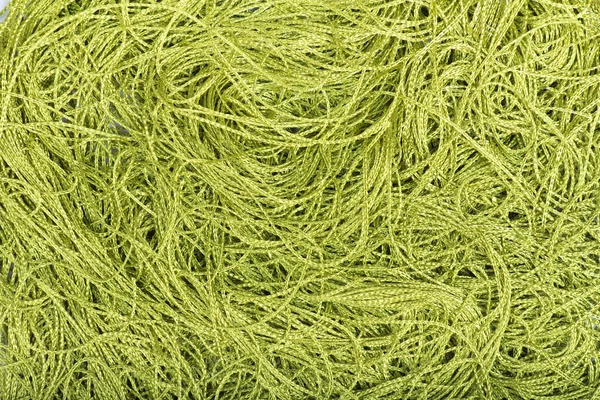 Green yarns chaotic background — Stock Photo, Image