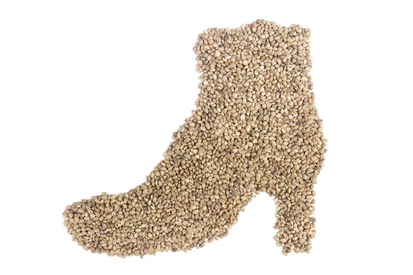 Hemp seeds in shape of woman's shoe — Stock Photo, Image