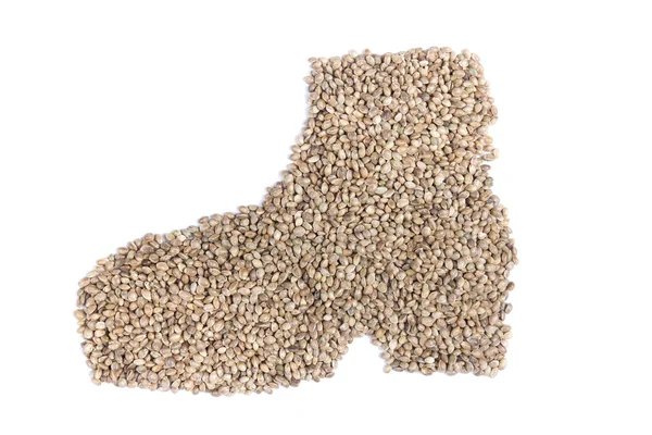 Hemp seeds in shape of man's shoe — Stock Photo, Image