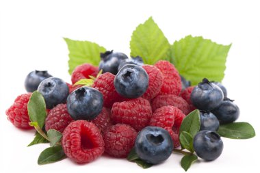 Raspberries and blueberries on white background clipart