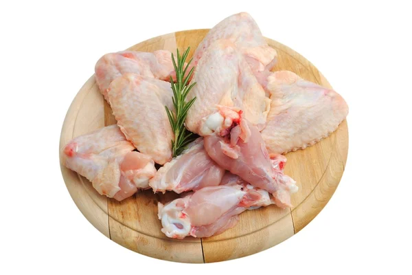 stock image Chicken wings on a wooden cutting board isolated on white