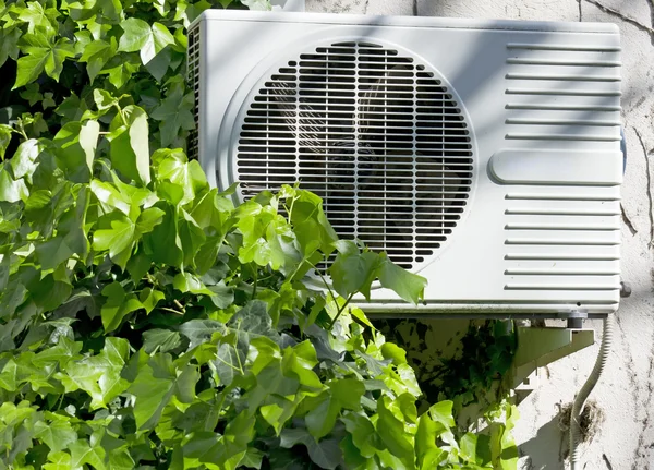 Air conditioner and ivy — Stock Photo, Image