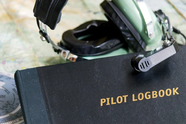 Logbook and headset — Stock Photo, Image