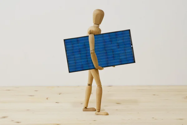 Mannequin with a photovoltaic panel — Stock Photo, Image