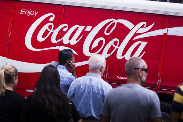 stock image Coca Cola logo in front of