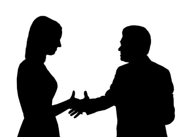 Silhueta do homem que aperta a mão a mulher jovem — Fotografia de Stock