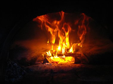 Fire wood burning in the furnace clipart