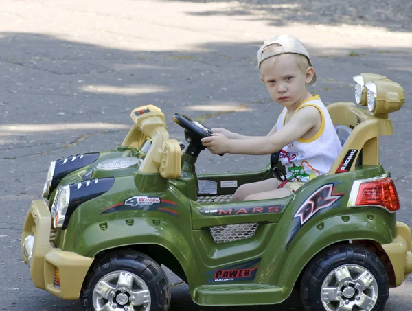 stock image Small boy in baby car