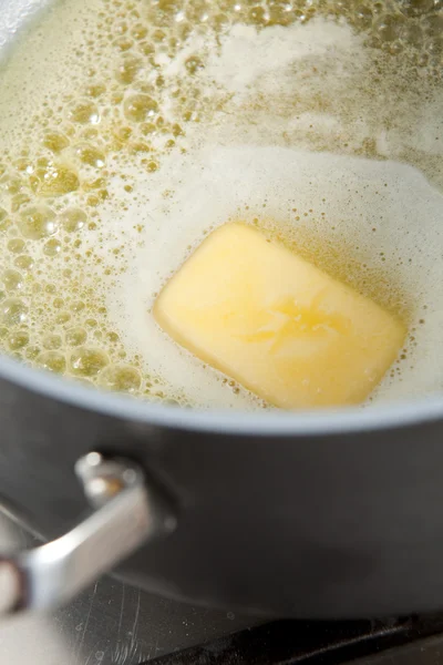 Smažení másla — Stock fotografie