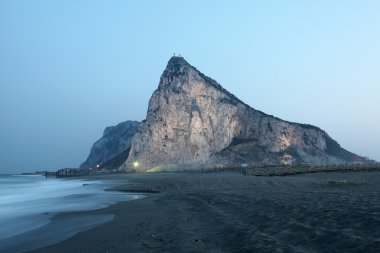 The Rock of Gibraltar illuminated at dusk clipart