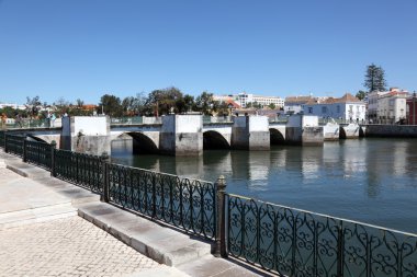 Ancient Roman bridge in Tavira, Algarve Portugal clipart