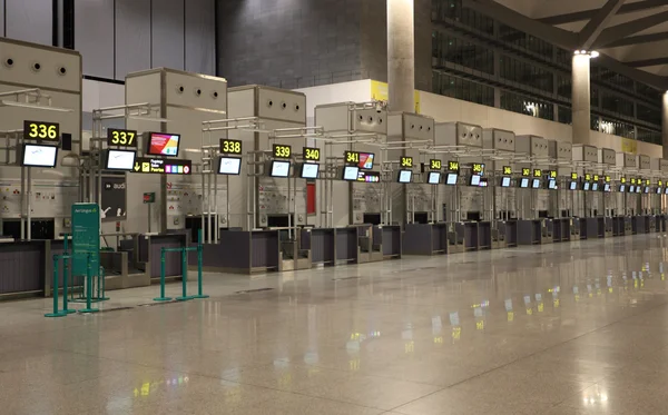 Empty airport check-in counters in Malaga, Spain — Stock Photo, Image