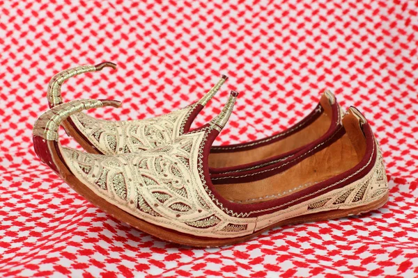 stock image Traditional oriental shoes over arabic cloth