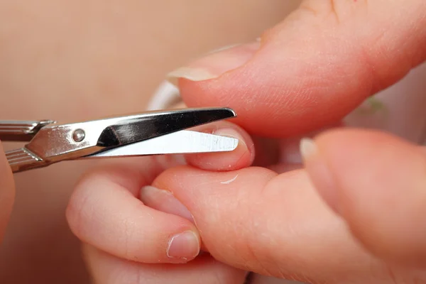Mother cutting little baby's fingernails — Stock Photo, Image