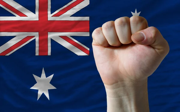 Puño duro frente a la bandera de Australia que simboliza el poder — Foto de Stock