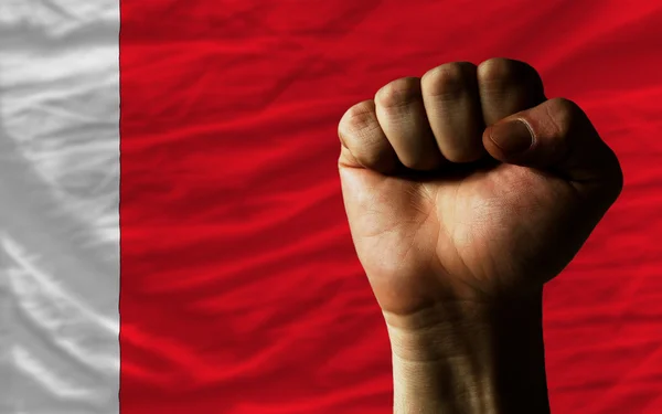 Hard fist in front of bahrain flag symbolizing power — Stock Photo, Image