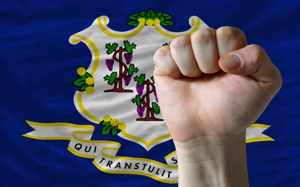 Us state flag of connecticut with hard fist in front of it symbo — Stock Photo, Image