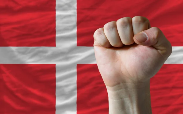 Hard fist in front of denmark flag symbolizing power — Stock Photo, Image