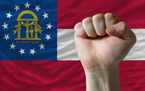 Oss ange flaggan i Georgien med hårda näve framför den symbolizi — Stockfoto