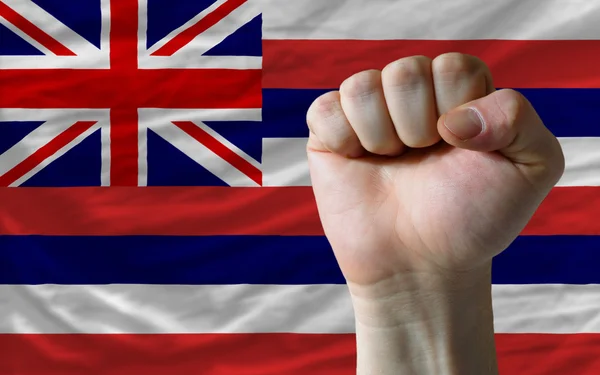 Us state flag of hawaii with hard fist in front of it symbolizin — Zdjęcie stockowe