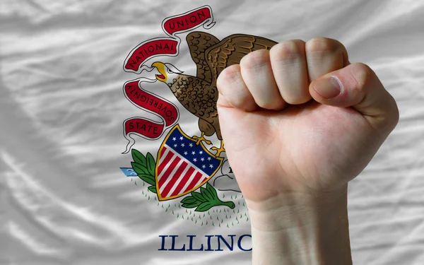 Us state flag of illinois with hard fist in front of it symboliz — Stock Photo, Image