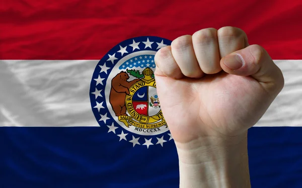 Us state flag of missouri with hard fist in front of it symboliz — Stock Photo, Image