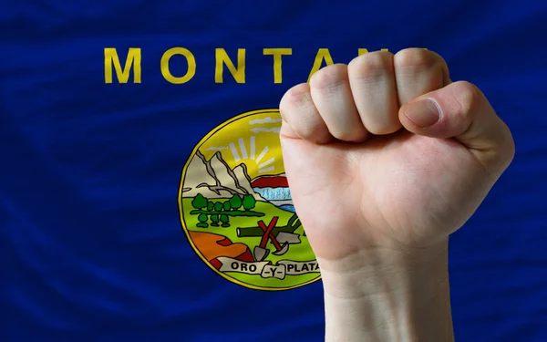 Uns Staatsflagge von Montana mit harter Faust davor symbolizi — Stockfoto