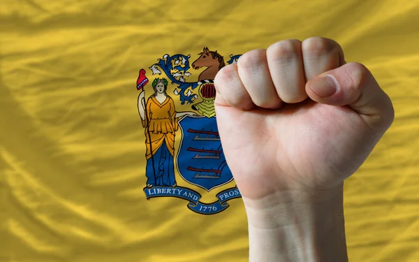 Нас державний прапор Нью-Джерсі з кулак жорсткий перед ним символ — стокове фото