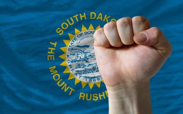Us state flag of south dakota with hard fist in front of it symb — Stock Photo, Image