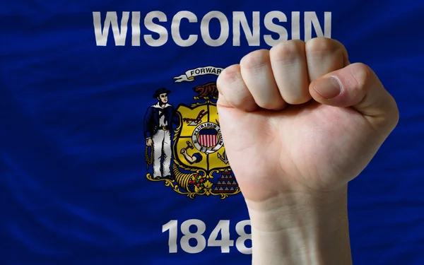 Us state flag of wisconsin with hard fist in front of it symboli — Stock Photo, Image