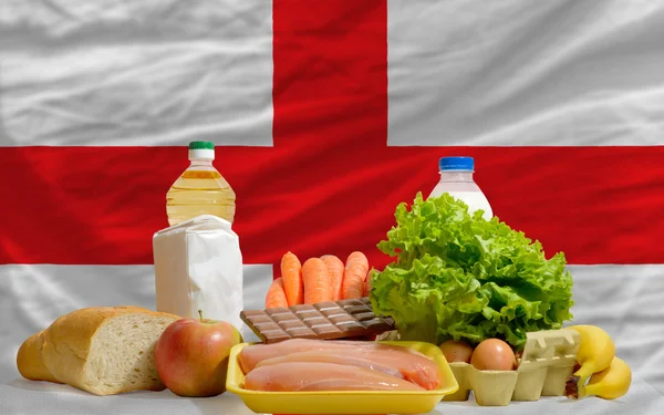 Basic food groceries in front of england national flag — Stock Photo, Image