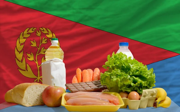 Grundläggande mat matvaror framför eritrea flagga — Stockfoto