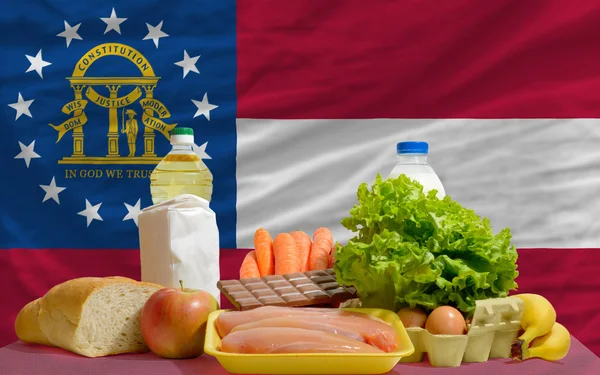 Abarrotes de alimentos básicos frente a Georgia bandera del estado —  Fotos de Stock