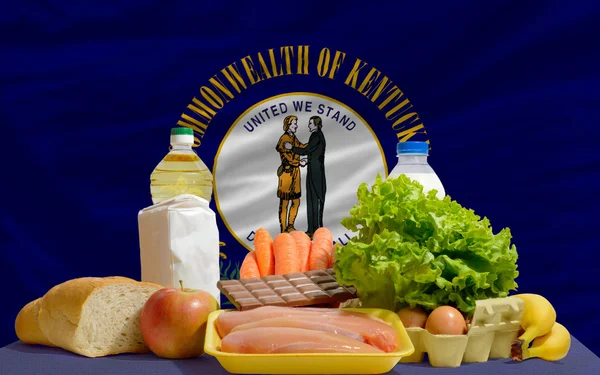Basic food groceries in front of kentucky us state flag — Stock Photo, Image